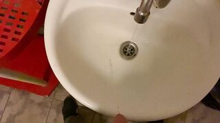 Hooligan in a public office toilet)) pissing in the sink POV