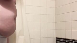 Desperately pissing in the shower