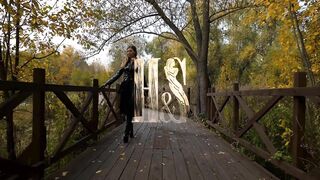 Naked under PVC raincoat babe teasing her amazing big boobs with leather gloves