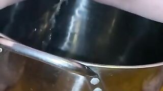 Sexy milf pisses in pot